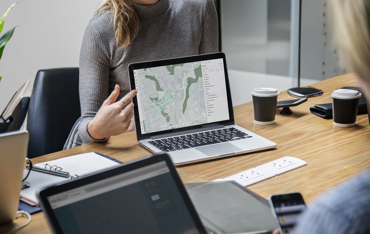 A LandLogic parcel map open on a laptop during a meeting